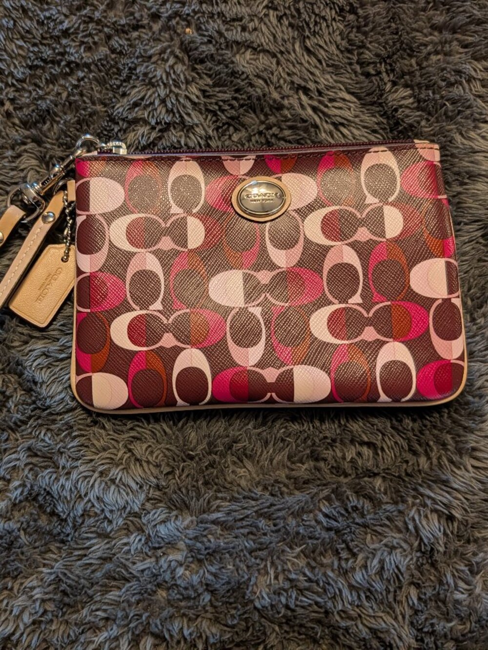 Coach Corner Zip Wristlet in a multicolor "Kaleidoscope" Signature Print